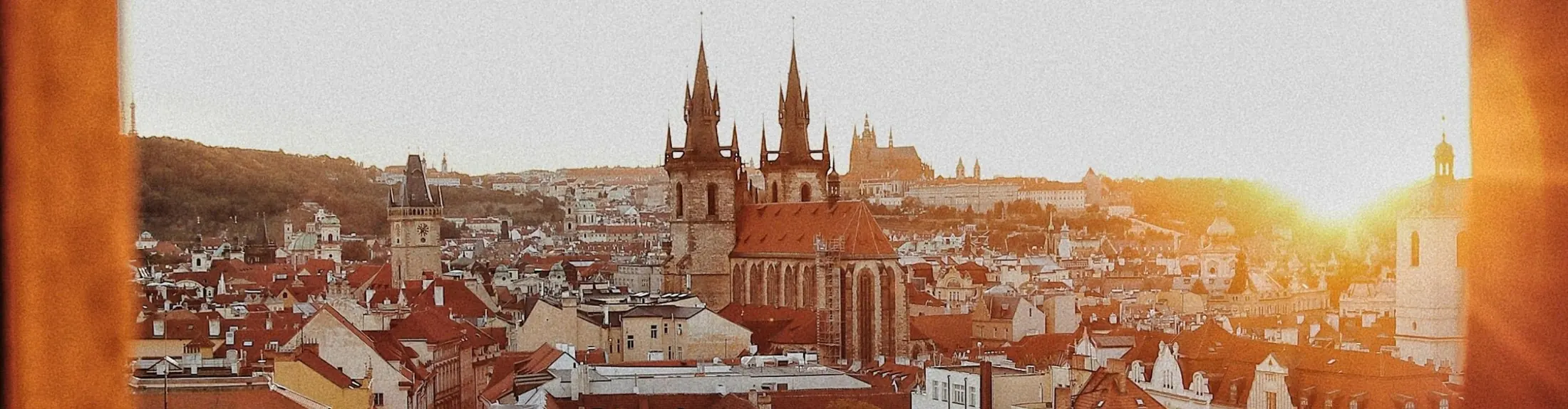 Prague Old Town rooftops and the Church of Our Lady before Týn at sunset